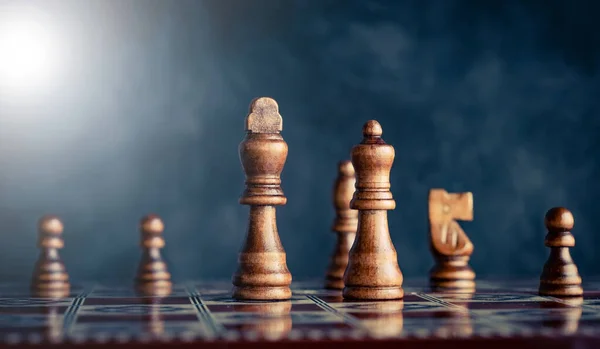 Chess pieces on reflective chess board — Stock Photo, Image