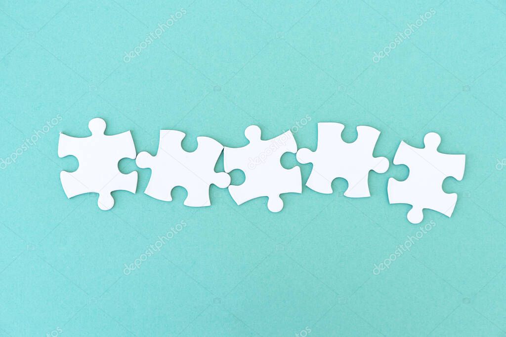 Jigsaw puzzle pieces in row