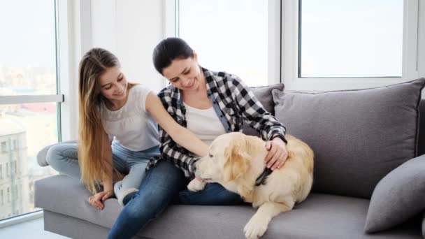 Happy daughter and mother with dog — Stock Video