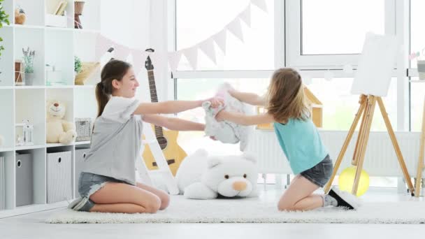 Happy children girls having pillow fight — Stock Video