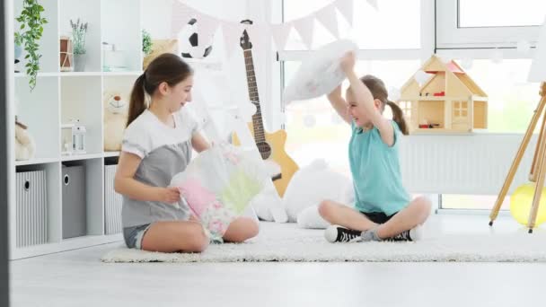 Happy children girls having pillow fight — Stock Video