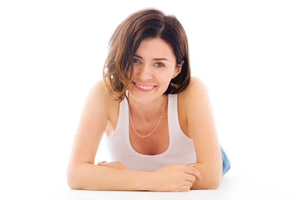 Beautiful young woman lying on a floor — Stock Photo, Image