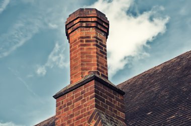 Brick chimney with blue sky