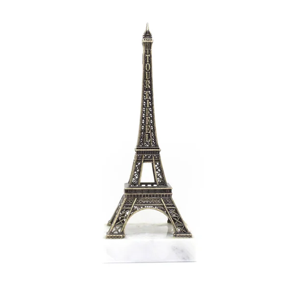 Paris Eiffel tower miniature on the marble stand isolated on white background — Stock Photo, Image