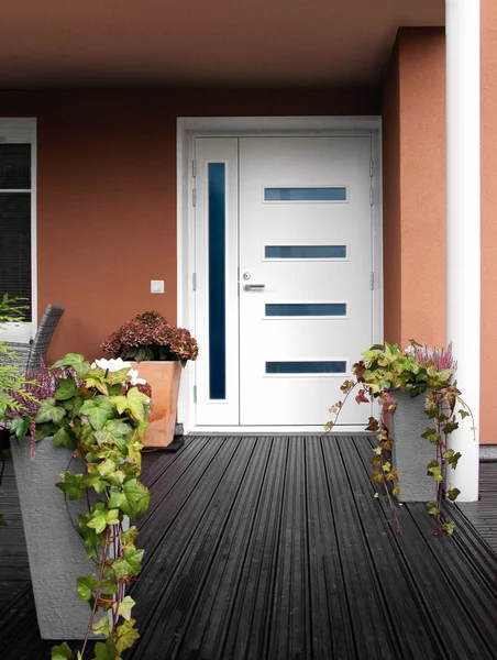 Modern stone house entrance white door — Stock Photo, Image