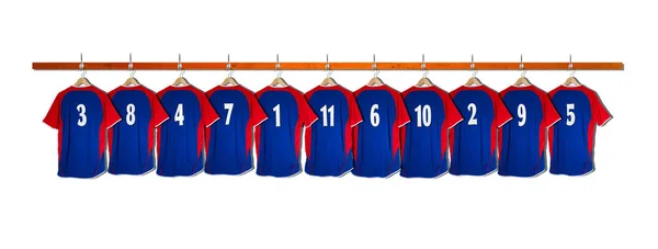 Row of Blue football shirts 3-5 hanging on locker room wall