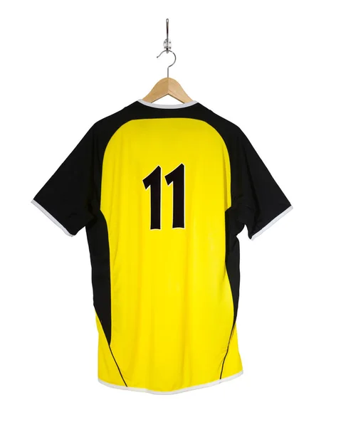 Yellow football shirt on hanger — Stock Photo, Image