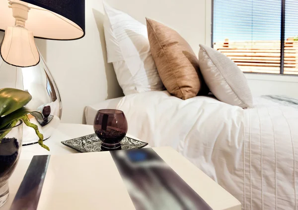 Close up of a book next to glass and a lamp on the table near to — Stock Photo, Image