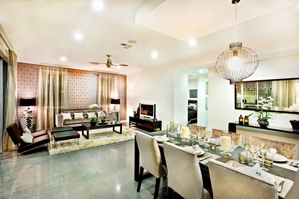 Luxury living room and dining area with hanging lights