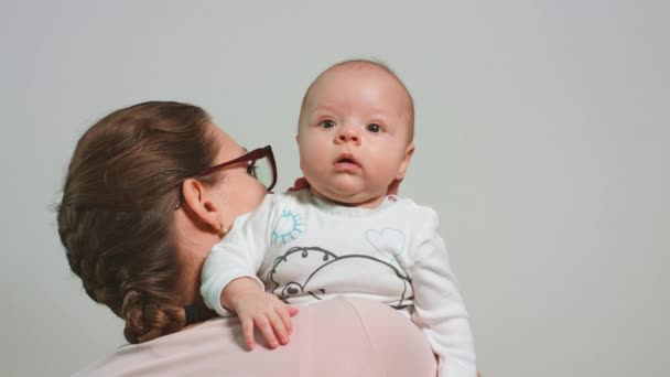 Mother Holds the Baby on Her Shoulder — Stock Video