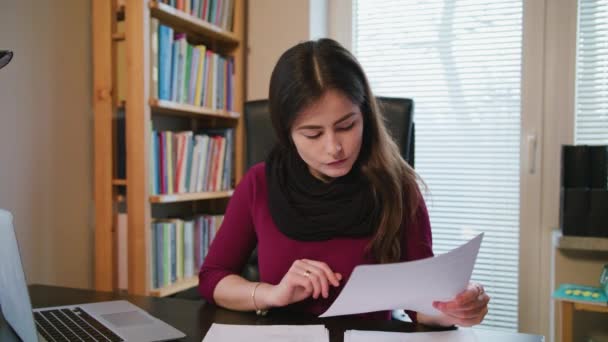 Serious Young Woman Looking on Documents. — Stock Video