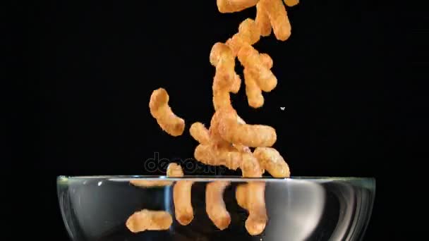 Corn Sticks Falling into a Glass Bowl — Stock Footage Corn Sticks Falling into a Glass Bowl Video Clip