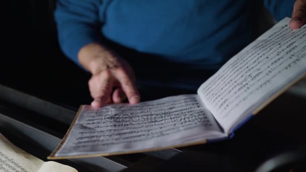 Conductor in an Orchestra Pit Studies Sheet Music — Stock Video