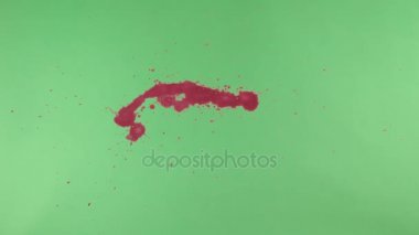 Kırmızı mürekkep sıçramak yeşil ekran arka planı üzerinde
