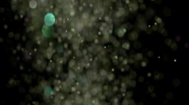 Siyah arka plan üzerinde patlayan gerçekçi Glitter.