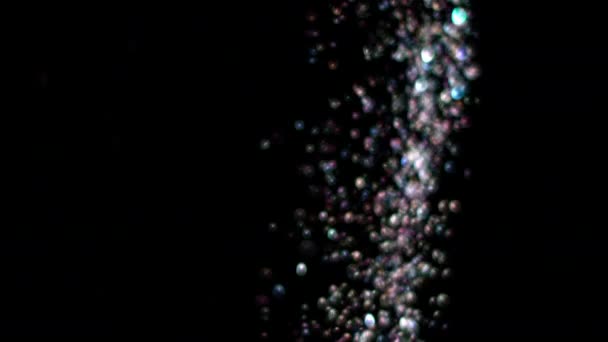 Esplosione di glitter realistici su sfondo nero . — Video Stock