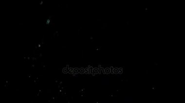 Siyah arka plan üzerinde patlayan gerçekçi Glitter.