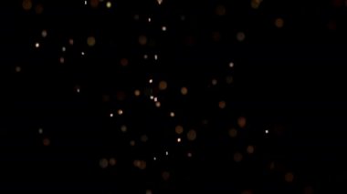 Siyah arka plan üzerinde patlayan gerçekçi Glitter.