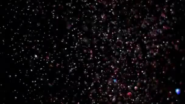 Realistische Glitter exploderen op zwarte achtergrond. — Stockvideo