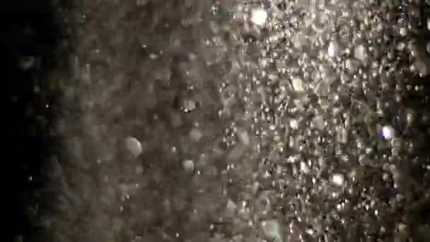 Glitter realista que explota en el fondo negro . — Vídeos de Stock