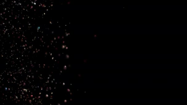 Esplosione di glitter realistici su sfondo nero . — Video Stock