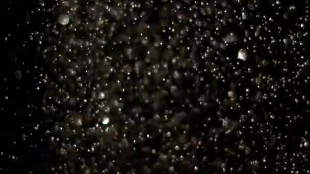 Esplosione di glitter realistici su sfondo nero . — Video Stock