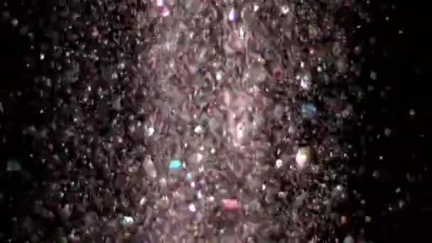 Glitter realista que explota en el fondo negro . — Vídeos de Stock