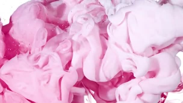 Tinta blanca y rosa en agua — Vídeos de Stock