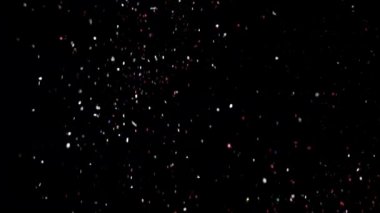 Siyah arka plan üzerinde patlayan gerçekçi Glitter.