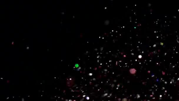 Glitter realista que explota en el fondo negro . — Vídeos de Stock