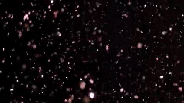 Glitter realista que explota en el fondo negro . — Vídeo de stock