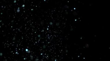 Siyah arka plan üzerinde patlayan gerçekçi Glitter.