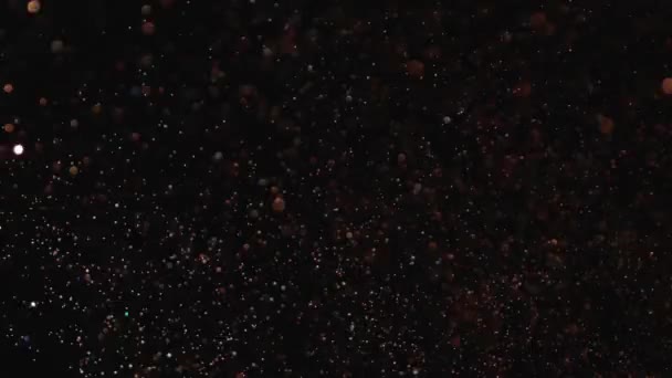 Realistické Glitter vybuchující na černém pozadí. — Stock video