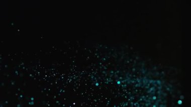 Siyah arka plan üzerinde patlayan gerçekçi Glitter.