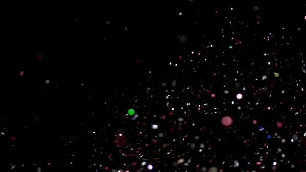 Realistiska Glitter exploderar på svart bakgrund. — Stockfoto