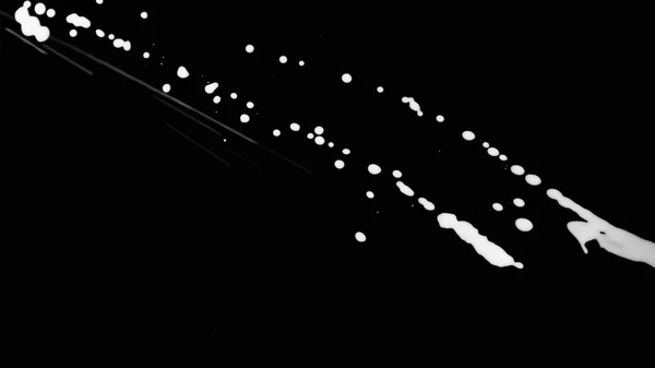 Witte inkt Splatter op zwart schermachtergrond — Stockfoto