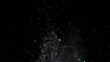 Siyah arka plan üzerinde patlayan gerçekçi Glitter.
