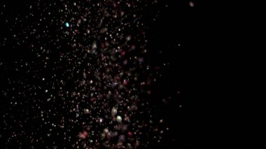Siyah arka plan üzerinde patlayan gerçekçi Glitter.