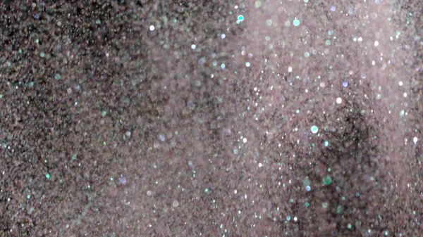 Glitter realista que explota en el fondo negro . —  Fotos de Stock
