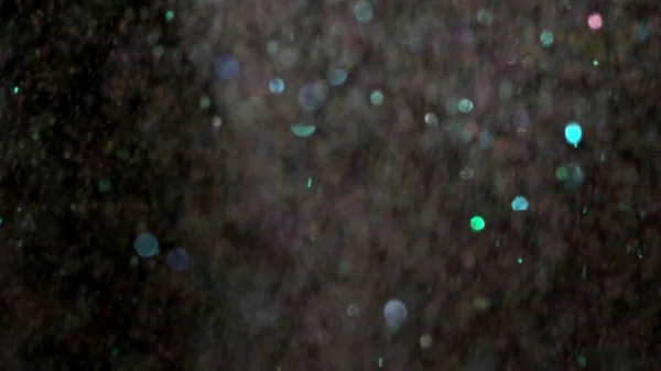 Glitter realista que explota en el fondo negro . — Foto de Stock