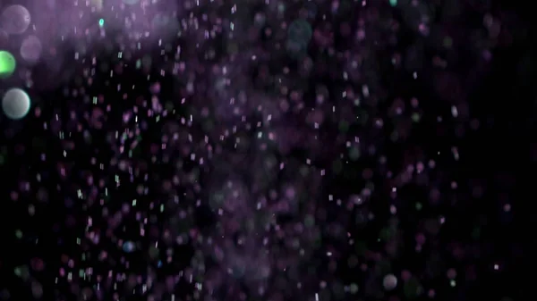 Siyah arka plan üzerinde patlayan gerçekçi Glitter. — Stok fotoğraf