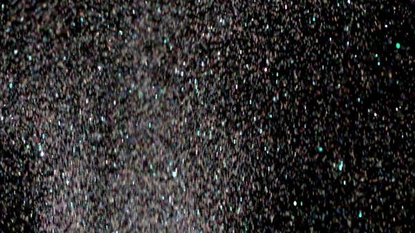 Esplosione di glitter realistici su sfondo nero . — Foto Stock