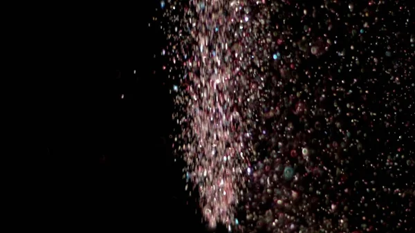 Glitter realista que explota en el fondo negro . — Foto de Stock