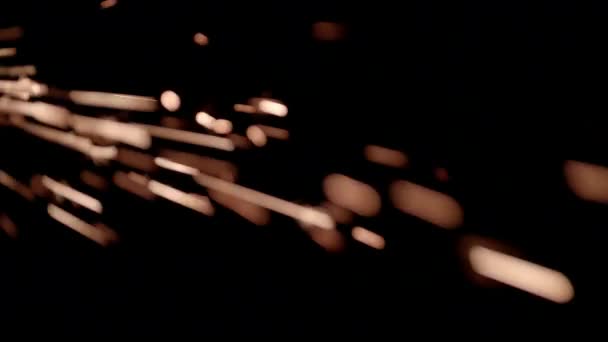 Étincelles jaune vif sur fond noir 