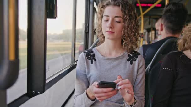 A Young Lady Using a Smartphone on the Bus — Stock Video