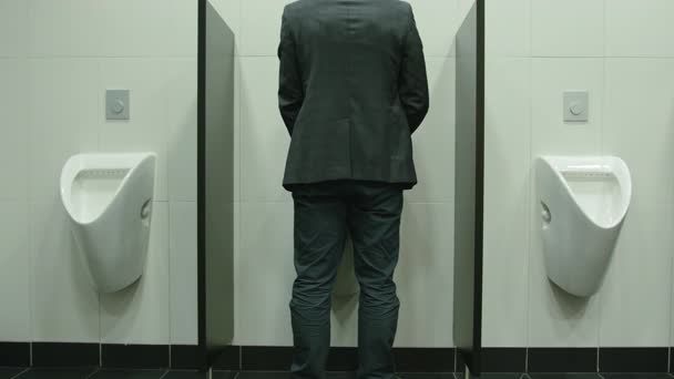 Man Peeing to Urinal in the Restroom — Stock Video