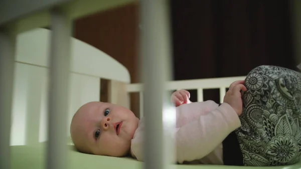 Close up of Infant Baby Laying in Crib Motion — Stock Photo, Image