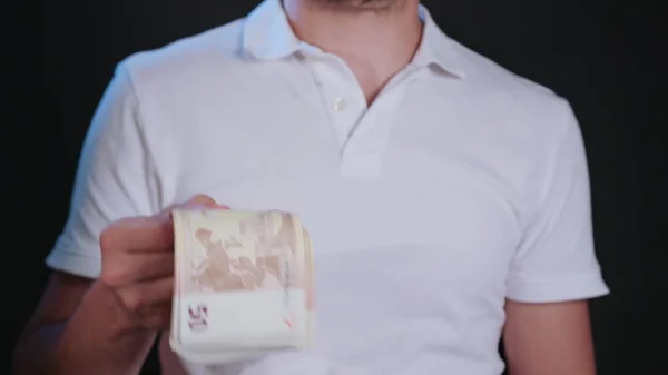 A Man in White T-Shirt Holding Cash — Stock Photo, Image