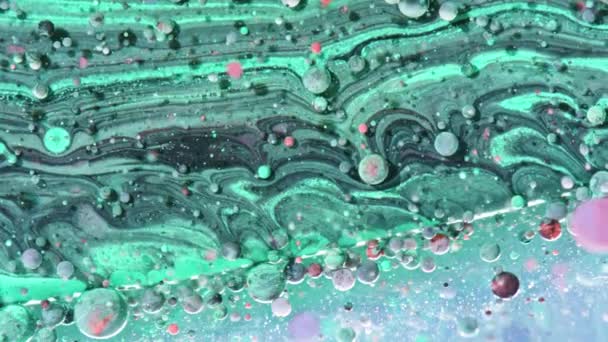 Яскраві кольори бульбашки повільний рух олії чорнило — стокове відео