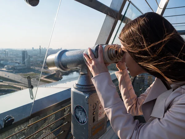 Tourist look observant binoculars telescope on panoramic view